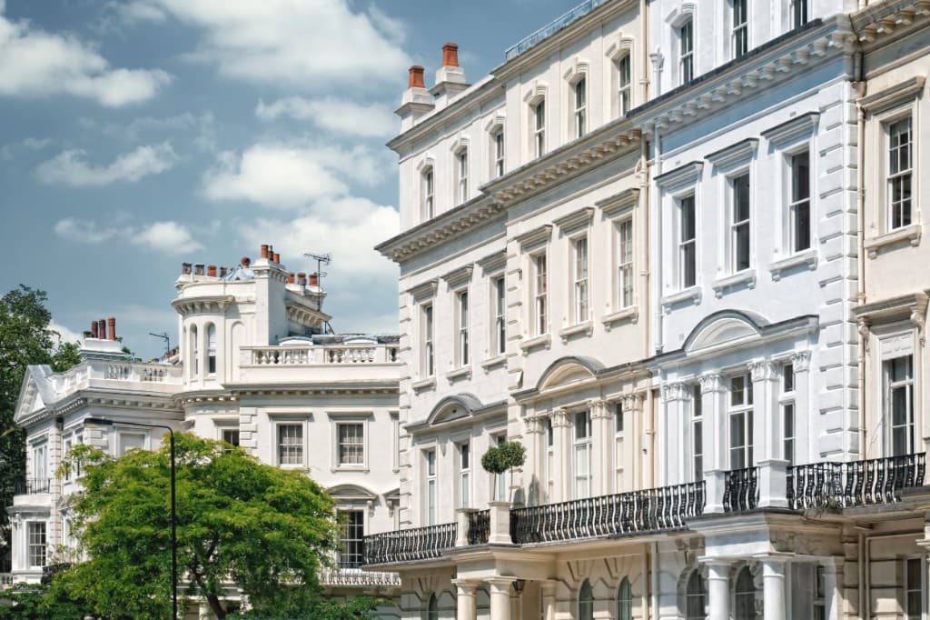 White period townhouses with wrought-iron balconies
